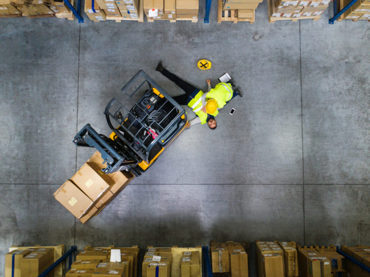 What Does Workers' Compensation Cover? - Warehouse workers after an accident in a warehouse.